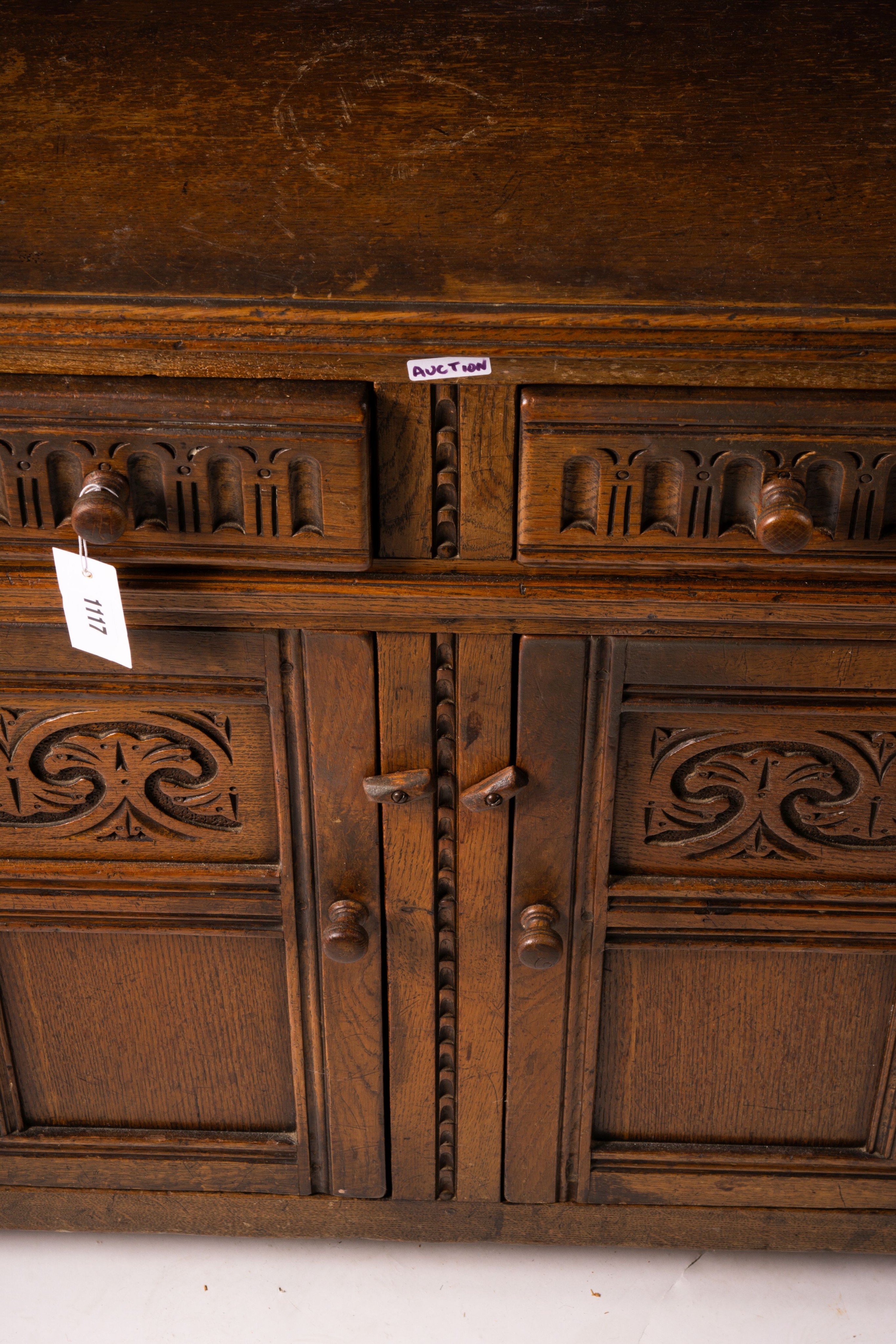 An 18th century style carved oak dresser, width 124cm, depth 46cm, height 175cm